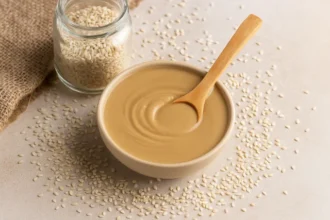 A clean minimalistic image showing Tahhiini as a nutrient-rich superfood in a natural wellness setting